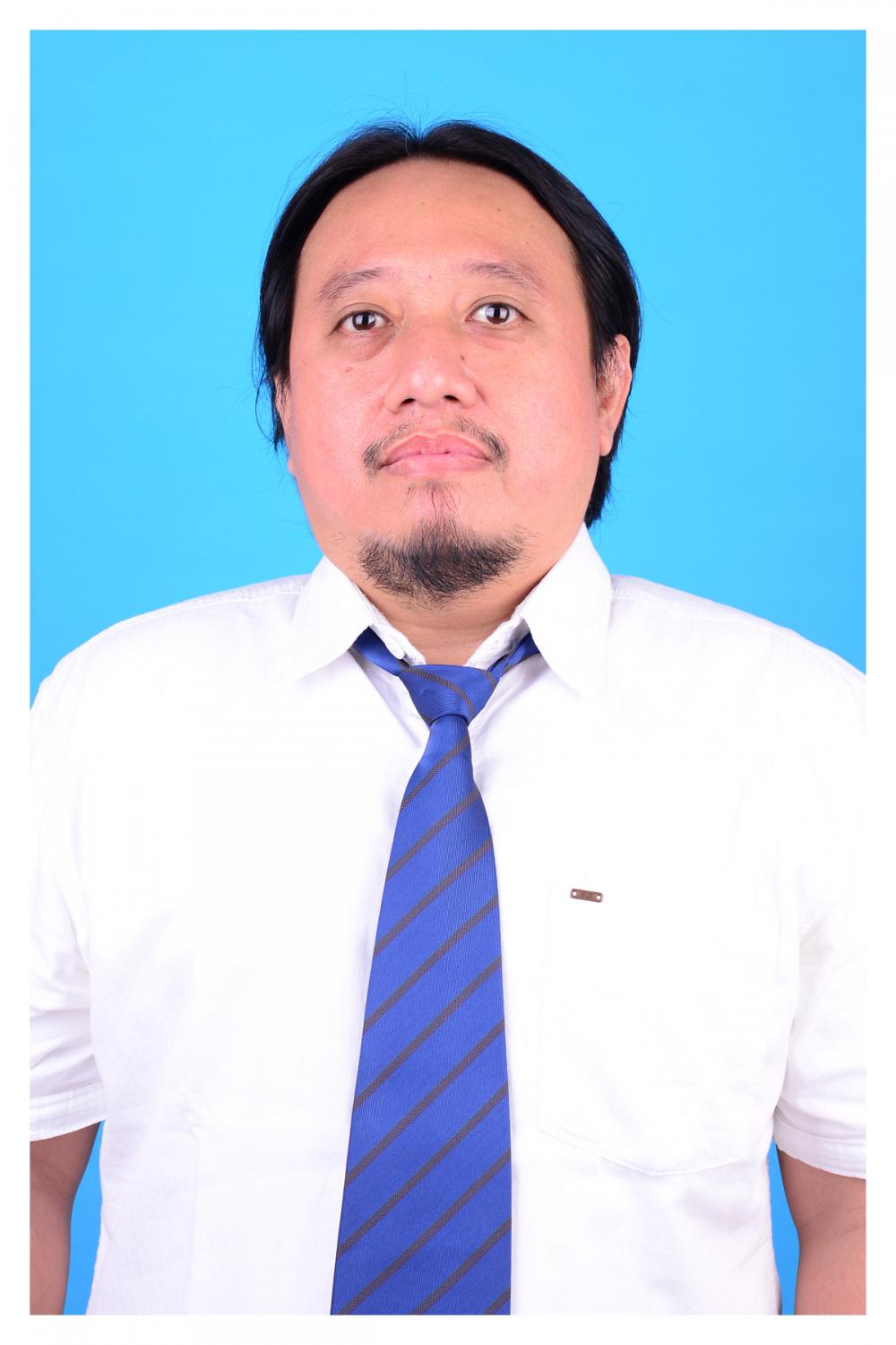 Dr. Fikri Budiman, M.Kom